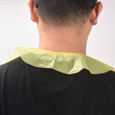 Apron monouso in plastica senza maniche per lo spazio della scrivania